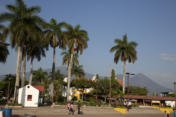 The main square of Nahuizalco with church and volcanoes in the background, Nahuizalco, El Salvador