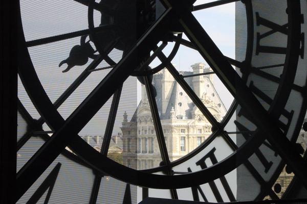 Picture of The Louvre seen through the glass of the giant clock in the Musée d'OrsayParis - France