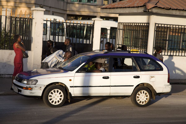 Shout your destination and price through the window - and you might be accepted as a passenger | Libreville taxi drivers | Gabon