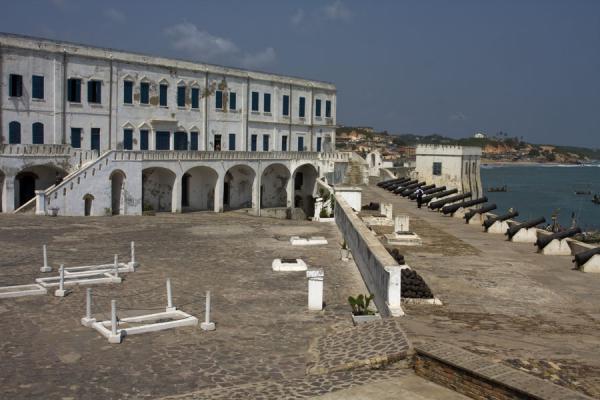 Courtyard of Cape Coast castle with cannons and graves | Cape Coast castle | Ghana