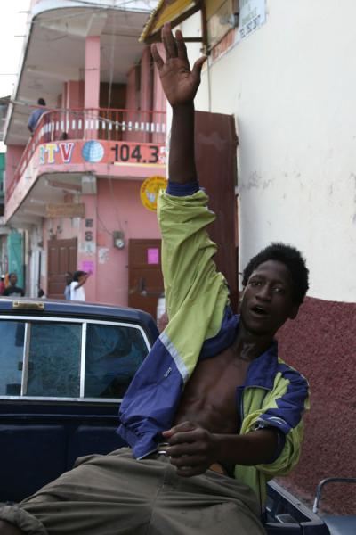 Guy in Cap-Haïtien showing off in the back of a pick up truck | Haitian people | Haiti
