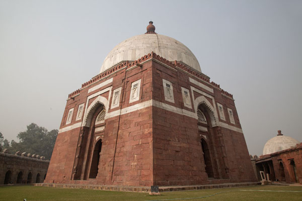 The red-and-white mausoleum of Ghiyath al-Din with white dome, India Looking up the mausoleum of Ghiyath al-Din, India