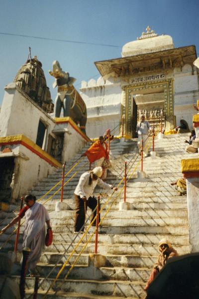 People on the stairs leading to one of the temples of Udaipur | Udaipur | India