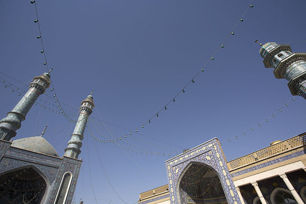 Looking up the minarets surrounding the old courtyard of the mausoleum | Hazrat-e Masumeh | Iran