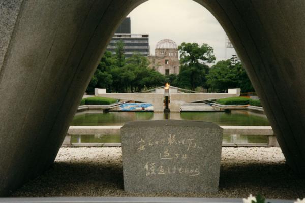 Picture of Inscription at the Memorial Cenotaph with the eternal flame in the backgroundHiroshima - Japan