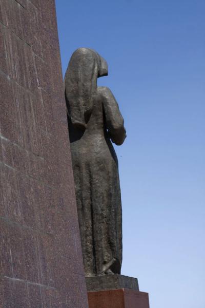 View from behind the female figure of the Victory Monument, Kyrgyzstan Female statue seen from behind the monument, Kyrgyzstan