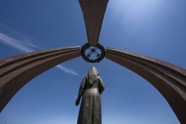 Looking up the statue, wreath, and three ribs representing a yurt, Kyrgyzstan