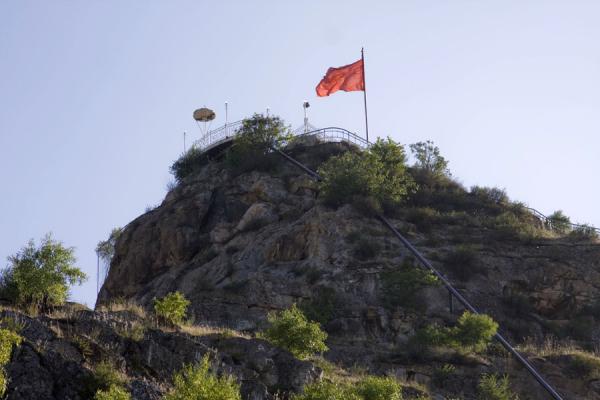 Kyrgyz flag flying over Solomon Throne, Kyrgyzstan