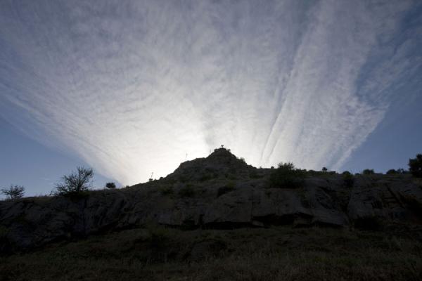 Sun disappearing behind Solomon Throne, Kyrgyzstan