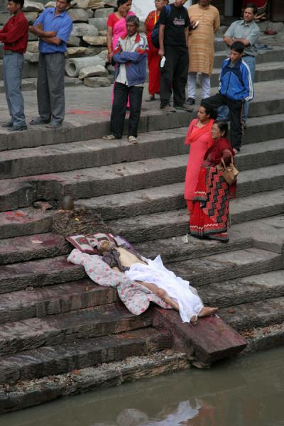 Picture of People and partly uncovered corpse on ghat at PashupatinathKathmandu - Nepal