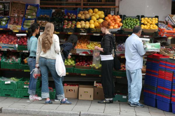 Selecting fruits in a local shop, Norway