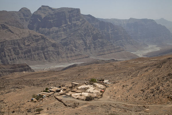 One of the small settlements perched on the rocky mountainside at the feet of Jebel Harim | Musandam mountains | Oman