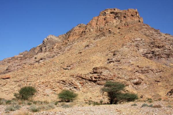 Mountain towering above Wadi Mayh, Wadi Mayh, Oman