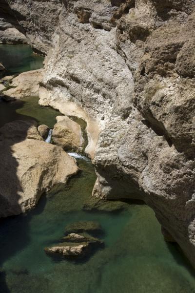 Water in the riverbed of Wadi Shab, Oman