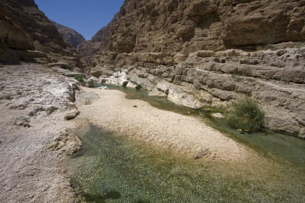 Water in the riverbed of Wadi Shab, Oman