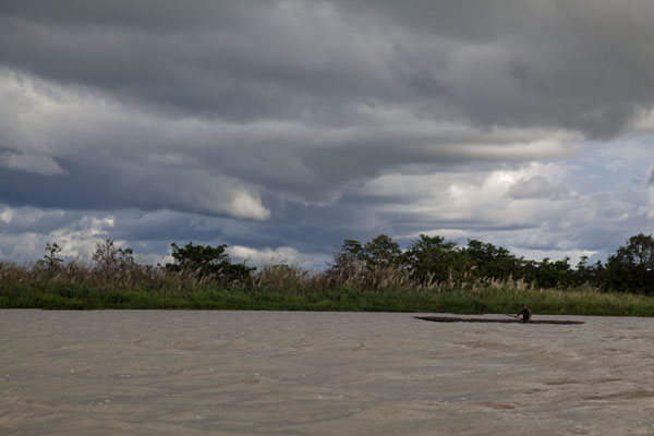 Canoe on the Sepik river under cloudy sky | Keram river | Papua New Guinea