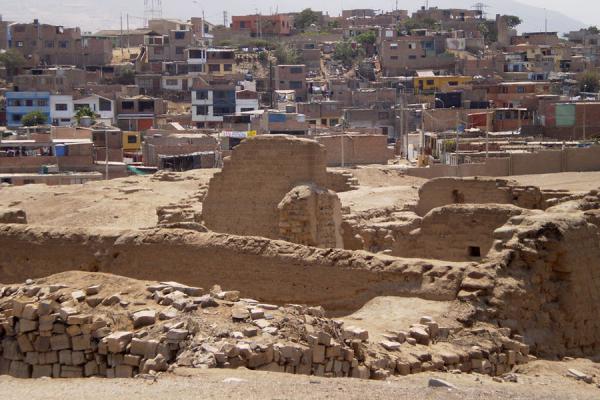 Some of the ruins of Pachacamac with adjacent village in the background | Pachacamac | Peru