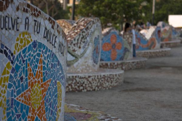 Intensely coloured artwork with broken tiles in the Parque del Amor, Peru Brightly coloured undulating wall in the Parque del Amor, Peru