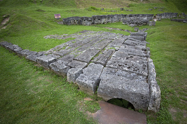 Old Dacian road of limestone slabs with the solar disk in the background, Sarmizegetusa Regia, Romania
