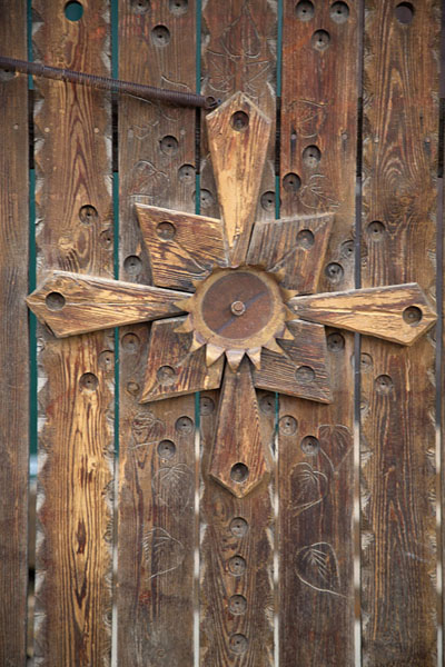 Detail of wooden door with cross | Esso | Russia