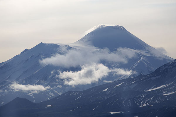 Plume of smoke coming out of Avachinsky volcano, Kamchatka from the air, Russia