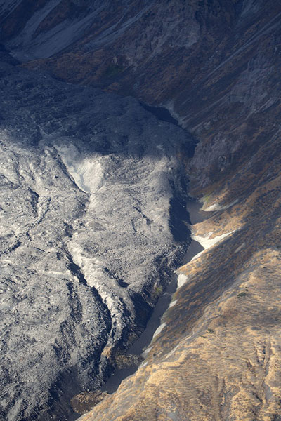 Recent lava field on the slopes of Karymsky volcano, Kamchatka from the air, Russia
