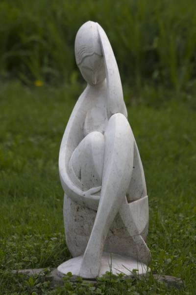 Elegant white woman on the grass in the Sculpture Park | Sculpture Park | Russia