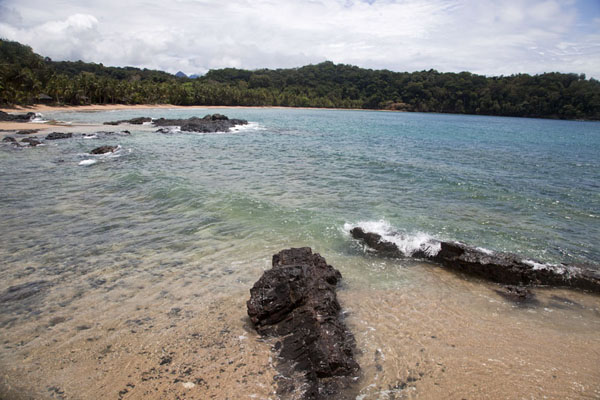 View from the wooden bridge with waves and beach, São Tomé and Príncipe