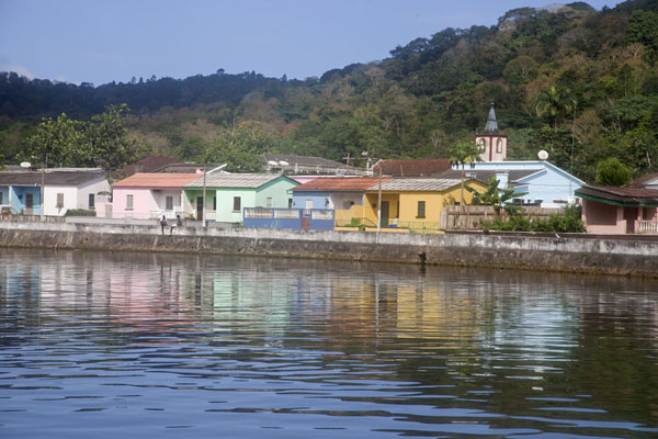 Colourful houses lining the Papagaio river bank in Santo Antonio, Santo Antonio, São Tomé and Príncipe