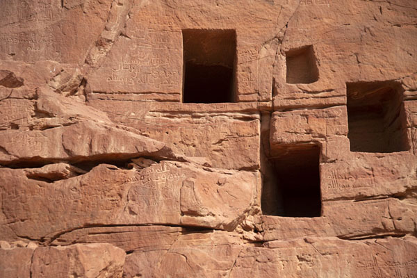 Close-up of tombs with texts carved into the rock face in Jebel Khuraybah | Dadan | Saudi Arabia