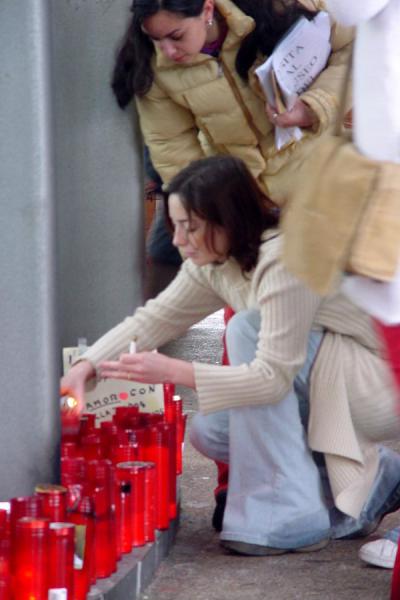 Keeping the candles alive at Atocha Station, Madrid, Spain