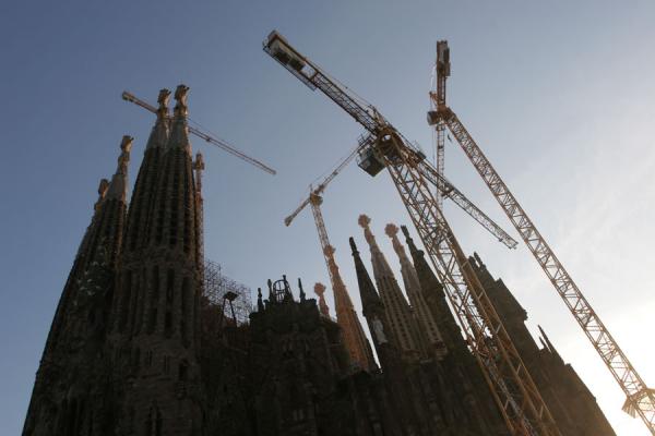 Towers and cranes defining the contours of the Sagrada Familia, Spain Towers of the Sagrada Familia with cranes, Spain