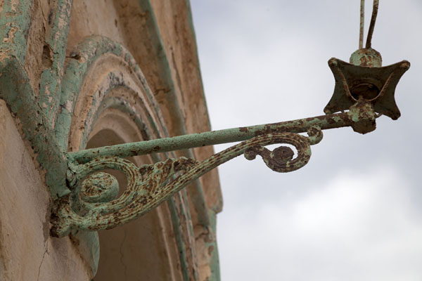 Detail of a rusty lantern on the best preserved building of old Suakin | Suakin Old Town | Sudan