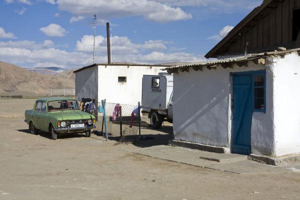 Whitewashed houses and old car in Bulunkul | Bulunkul | Tajikistan