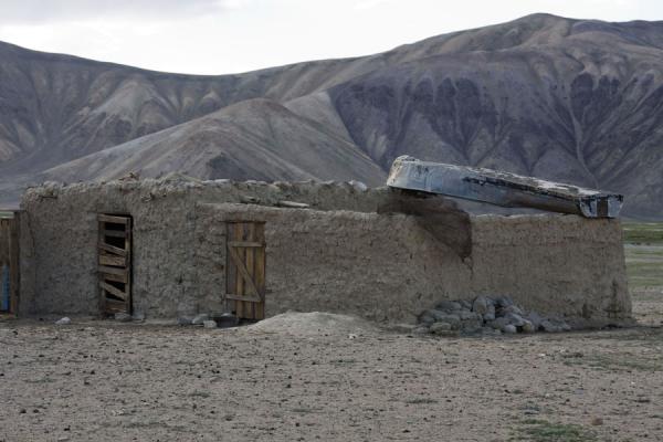 House with boat on its roof in Bulunkul | Bulunkul | Tajikistan