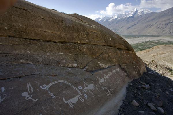 View from a rock with petroglyphs, Wakhan valley in the background, Tajikistan Rock with petroglyphs, Tajikistan