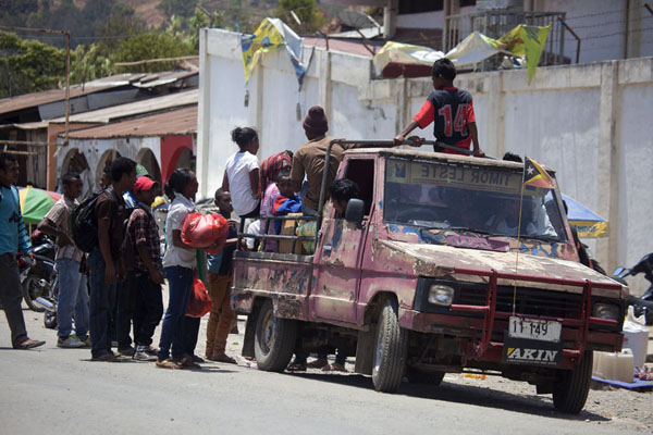 People getting into a pick-up truck to go home | MarchÃ© de Maubisse | Timor Oriental