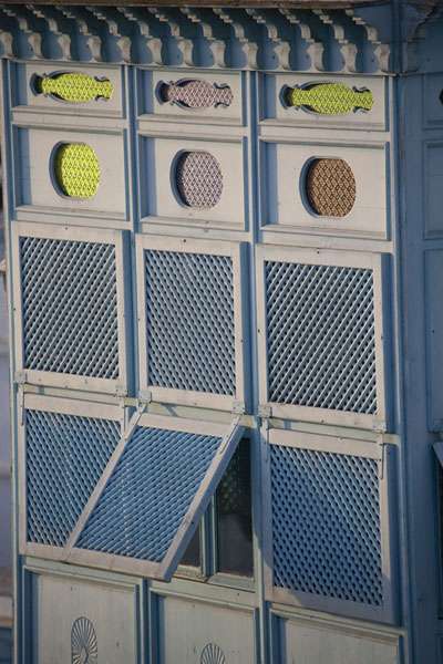 Close-up of wooden balcony with coloured windows in Sidi Bou Said, Tunisia