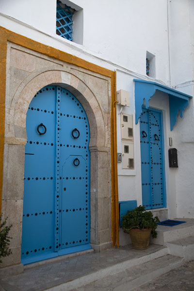Wal with blue doors in Sidi Bou Said, Tunisia