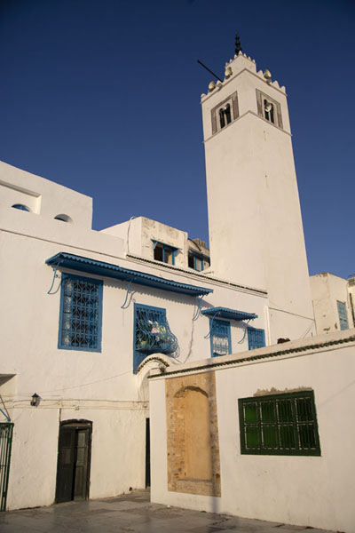 Small square with minaret above the main street of Sidi Bou Said, Tunisia