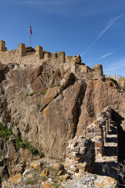 Stone ramparts of Afyonkarahisar Castle atop sheer volcanic rock, Türkiye