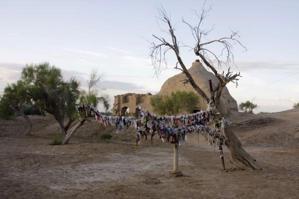 Pieces of cloth tied to a line near the Mausoleum of Mohammed Ibn Zayd, Turkmenistan