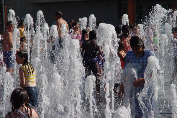 Children playing in water of Piccadilly Gardens, United Kingdom