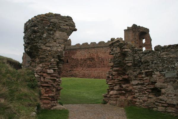 The old gate and Tantallon Castle in the background, United Kingdom